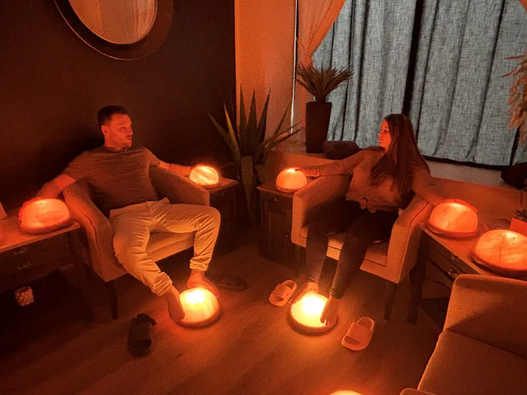 Couple enjoying a shared experience at a wellness spa in Stratford with hand and foot salt therapy