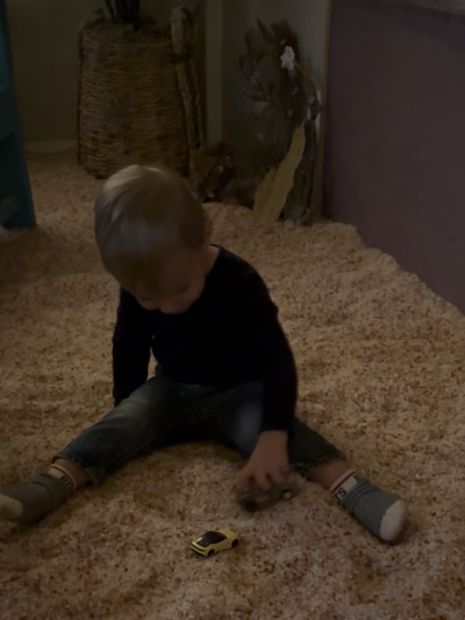 Young child playing in the Salt Cabin during a Little Breathers Club halotherapy session.