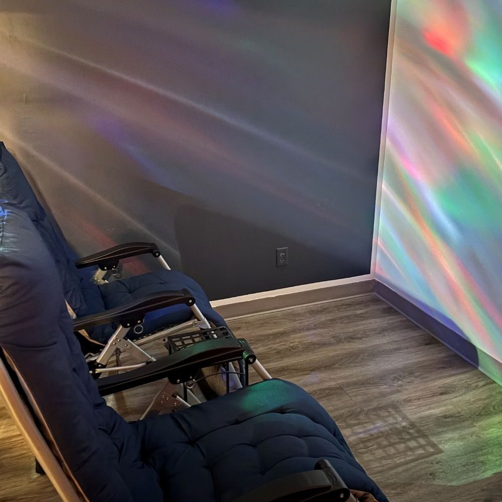 Aurora Sound Bath room with soft wave lighting and reclining chairs at The Salt Cabin in Stratford